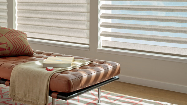 blinds in sitting area with leather chaise lounge